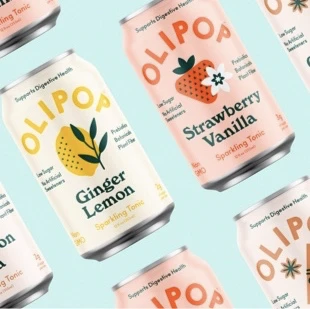 Rows of ginger lemon and strawberry vanilla cans of Olipop sparkling tonic beverage.